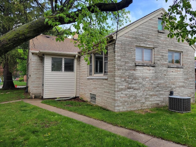 view of property exterior featuring cooling unit and a lawn