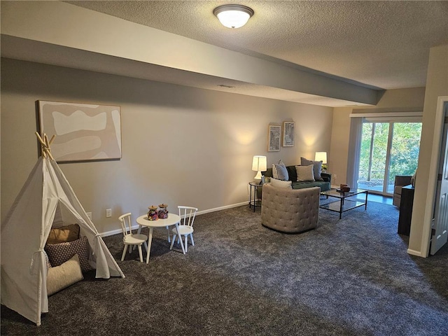 living room with dark carpet and a textured ceiling