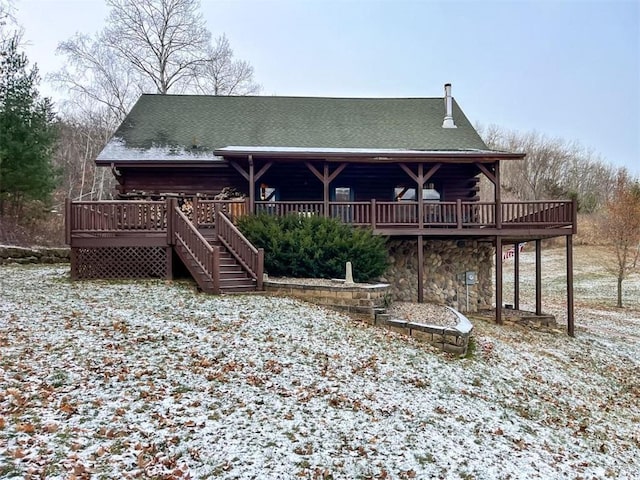 rear view of property with a deck