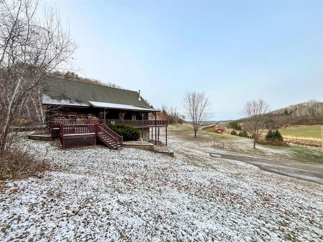 back of house featuring a wooden deck