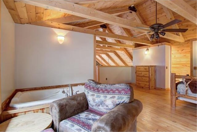 bedroom featuring light wood-type flooring, lofted ceiling with beams, wooden walls, and wooden ceiling