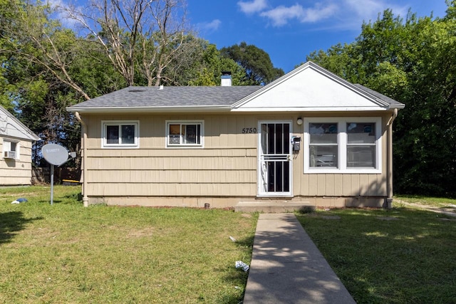 view of front of home with a front yard