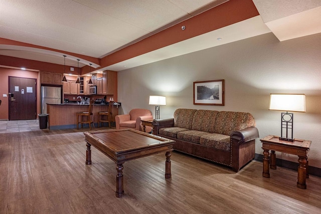 living room with dark hardwood / wood-style floors and lofted ceiling