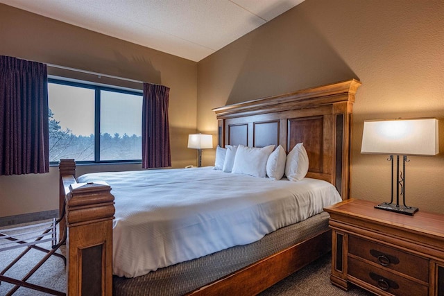 carpeted bedroom featuring vaulted ceiling