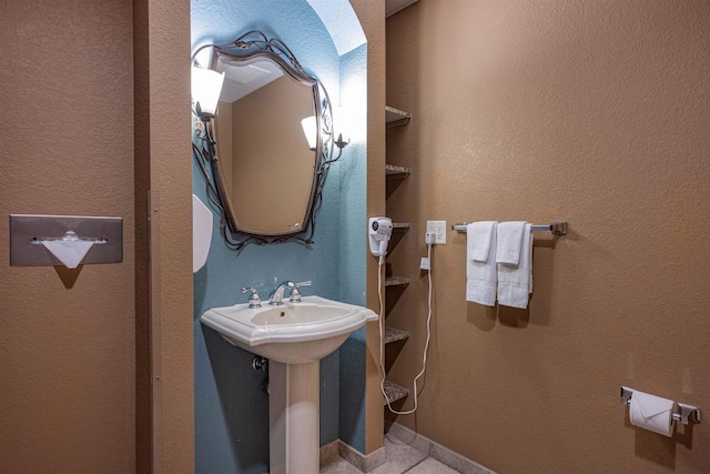 bathroom with tile patterned flooring and sink