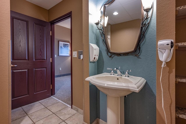 bathroom featuring tile patterned flooring and sink