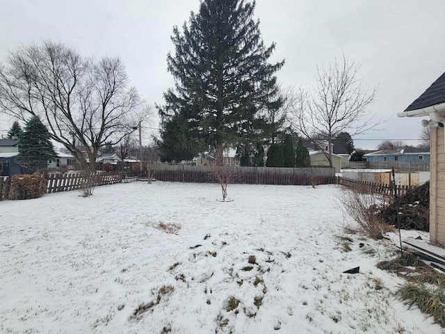 view of yard covered in snow