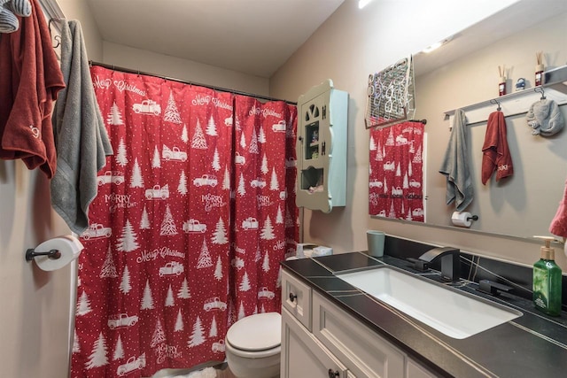 bathroom with vanity and toilet