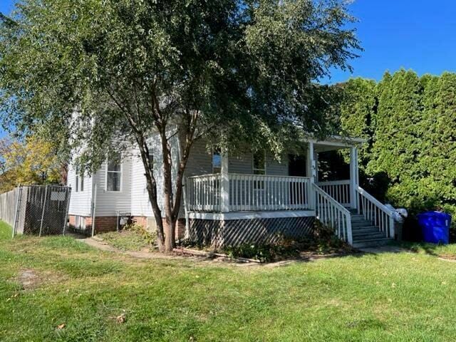 view of front of house featuring a front yard and covered porch