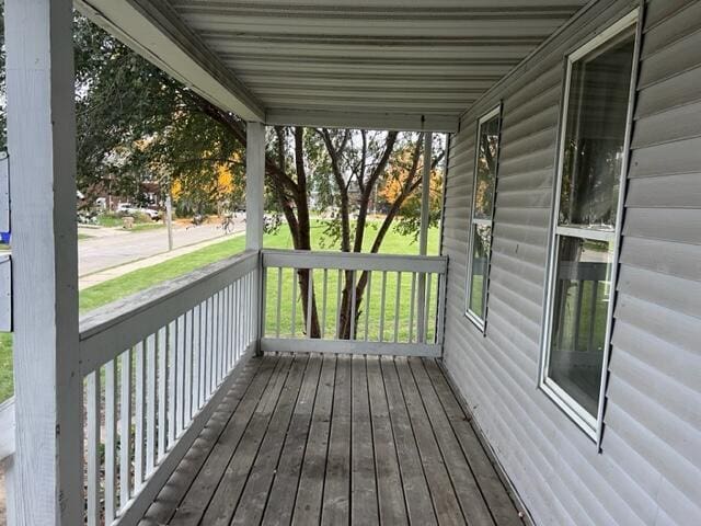 wooden terrace with a porch