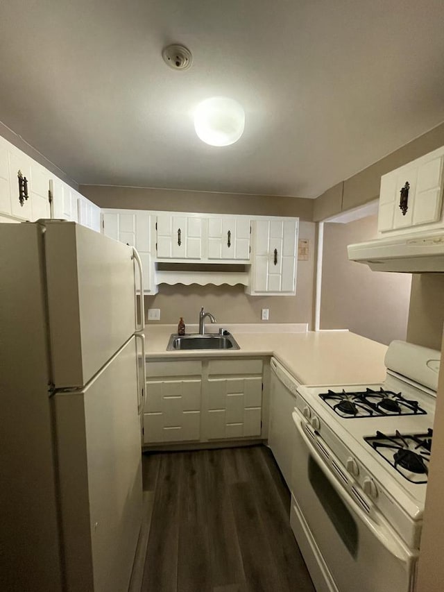 kitchen featuring dark hardwood / wood-style flooring, sink, white cabinets, and white appliances