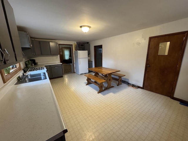 kitchen with white refrigerator and sink