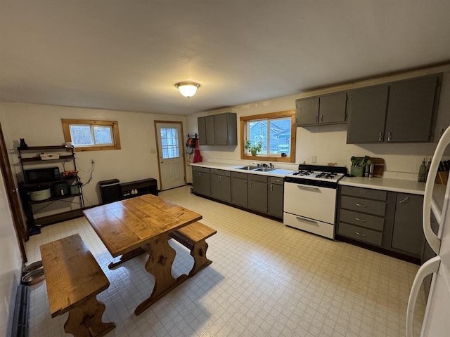 kitchen featuring sink and white appliances