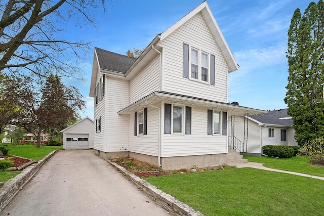 view of property featuring a garage, an outdoor structure, and a front lawn