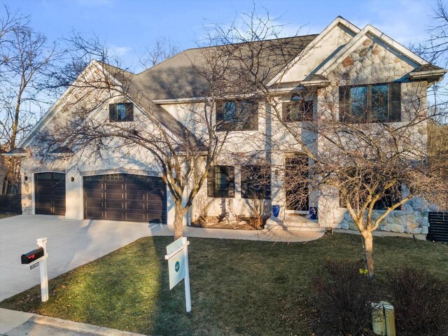 6461 Blue Heron Pointe Dr, Waterford, WI 53185 - view of front of house featuring a garage and a front yard