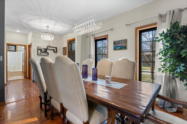 6461 Blue Heron Pointe Dr, Waterford, WI 53185 - dining room featuring hardwood / wood-style floors and a chandelier