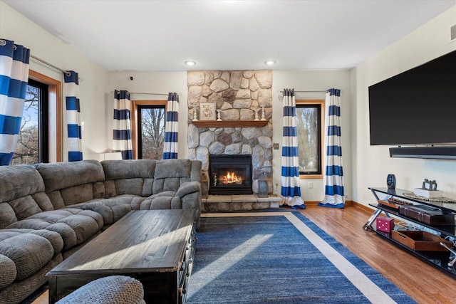 6461 Blue Heron Pointe Dr, Waterford, WI 53185 - living room with hardwood / wood-style flooring and a stone fireplace