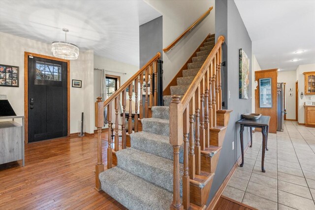 6461 Blue Heron Pointe Dr, Waterford, WI 53185 - entrance foyer featuring a chandelier and light hardwood / wood-style floors