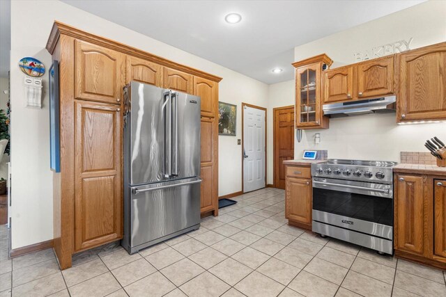 6461 Blue Heron Pointe Dr, Waterford, WI 53185 - kitchen with light tile patterned flooring and premium appliances