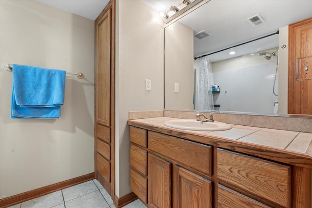 6461 Blue Heron Pointe Dr, Waterford, WI 53185 - bathroom featuring tile patterned floors, vanity, and walk in shower