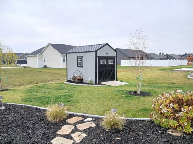 view of outbuilding with a yard