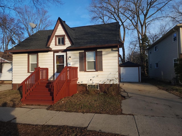 view of front facade with a garage and an outbuilding