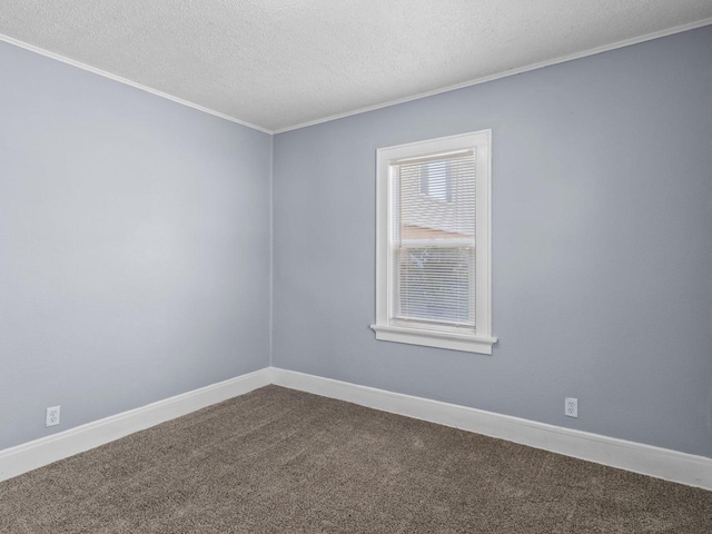 unfurnished room with crown molding, carpet, and a textured ceiling