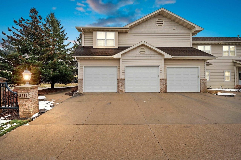 front of property with a garage