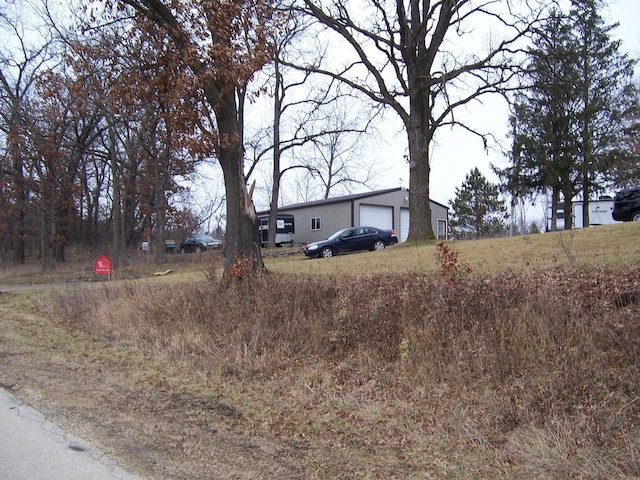 view of front of house featuring an outbuilding and a garage