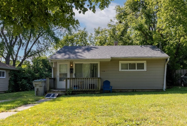 view of front of home featuring covered porch and a front yard