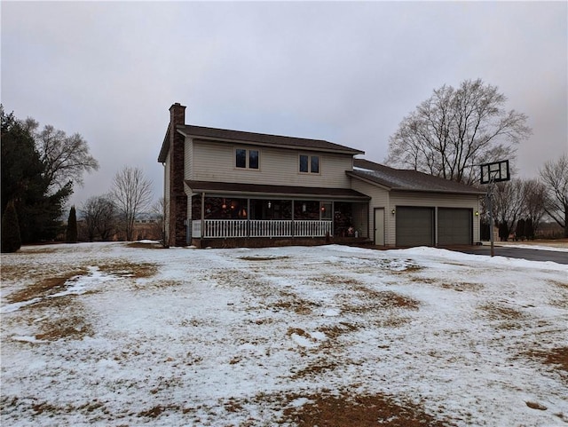 view of front of house featuring a garage and covered porch