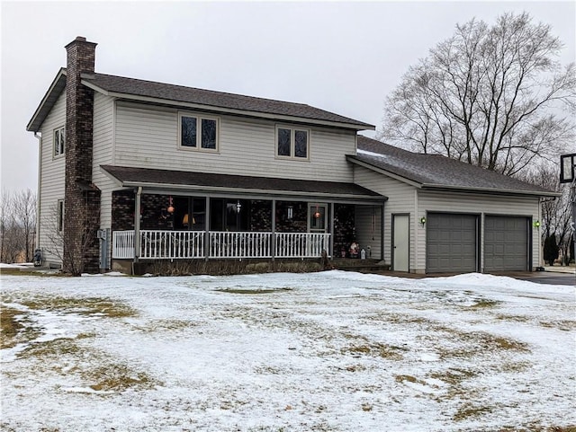 view of front of property with a porch and a garage