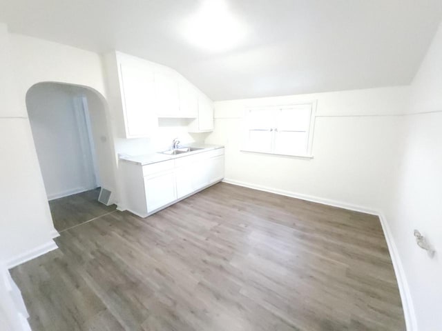 interior space with sink and dark wood-type flooring