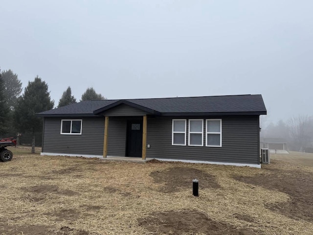 ranch-style house featuring central AC unit