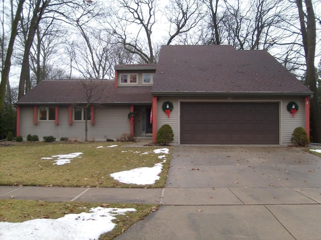 view of front property featuring a front yard and a garage