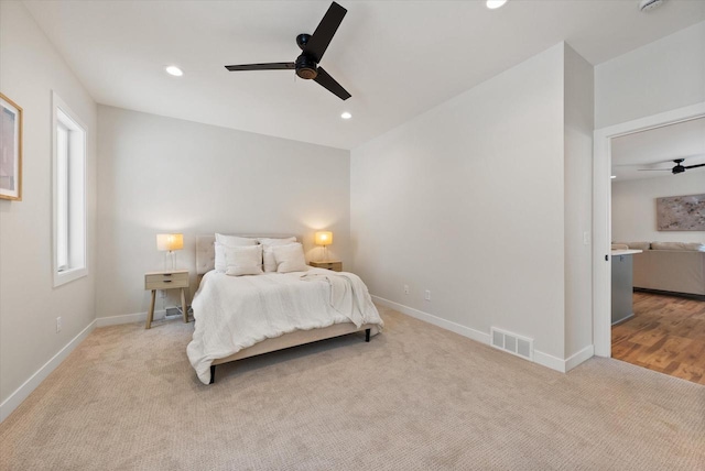 carpeted bedroom featuring ceiling fan