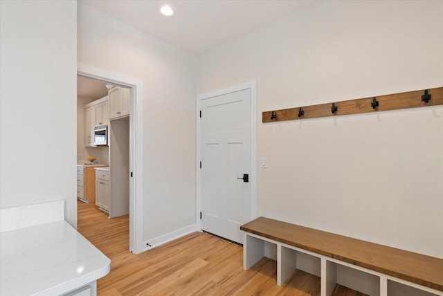 mudroom with light hardwood / wood-style flooring