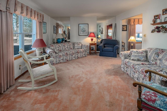 carpeted living room featuring a healthy amount of sunlight