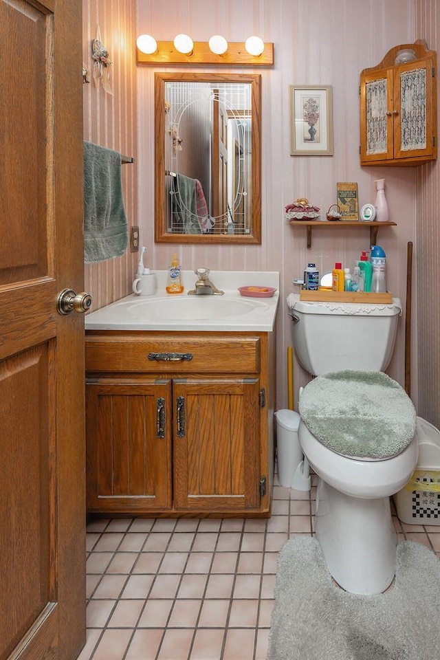 bathroom featuring tile patterned floors, toilet, and vanity