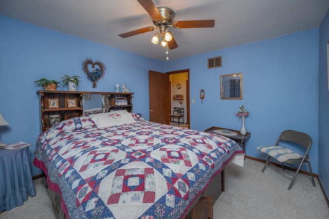 bedroom featuring ceiling fan and light colored carpet