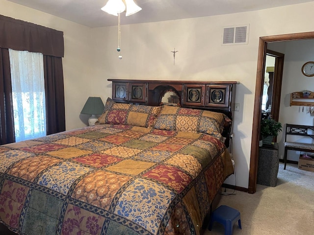 bedroom with light carpet