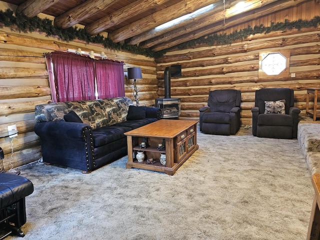 carpeted living room with beam ceiling, a wood stove, rustic walls, and wood ceiling