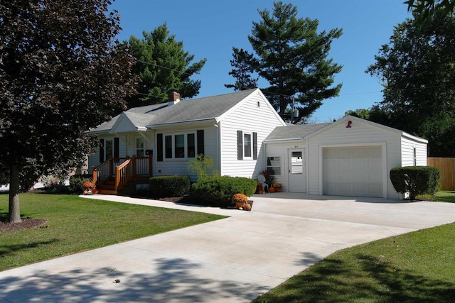 view of front of property featuring a garage and a front yard