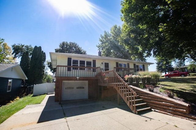 view of front of home featuring a deck and a garage