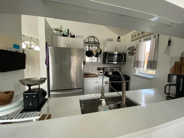 kitchen with tasteful backsplash and stainless steel appliances