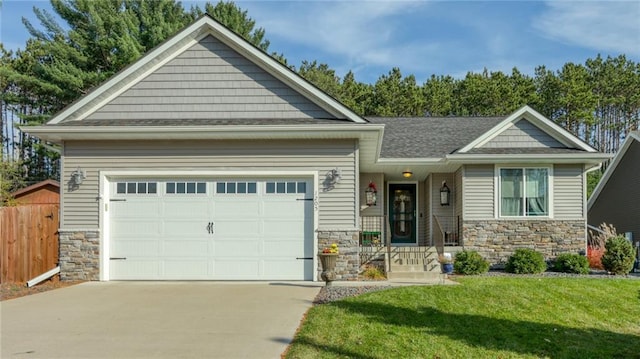 craftsman-style house with a front lawn and a garage