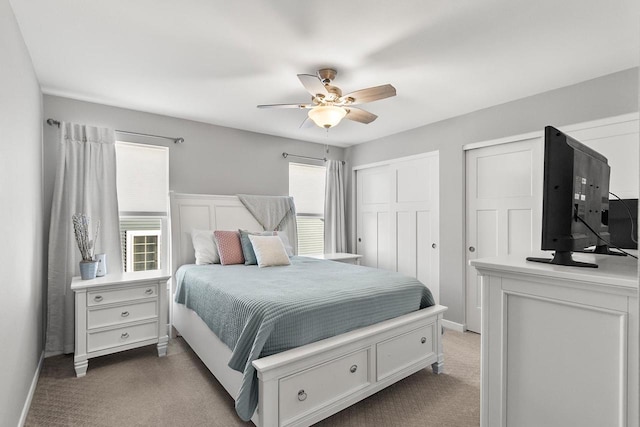 carpeted bedroom with ceiling fan