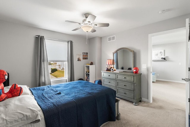 carpeted bedroom with ceiling fan