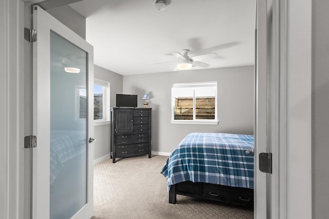 carpeted bedroom with ceiling fan