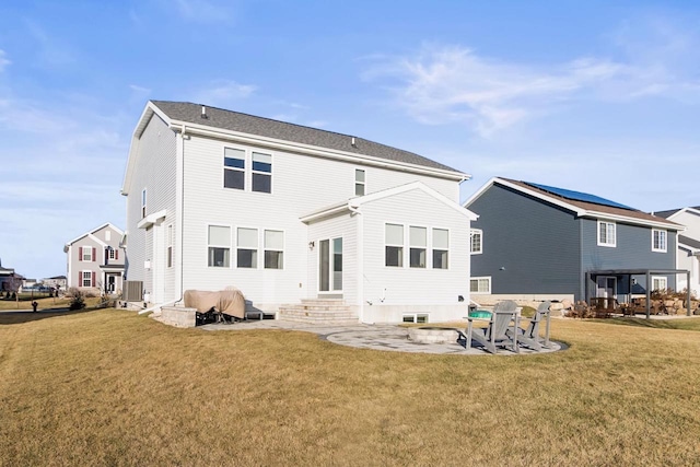 rear view of property with central air condition unit, a patio area, and a lawn